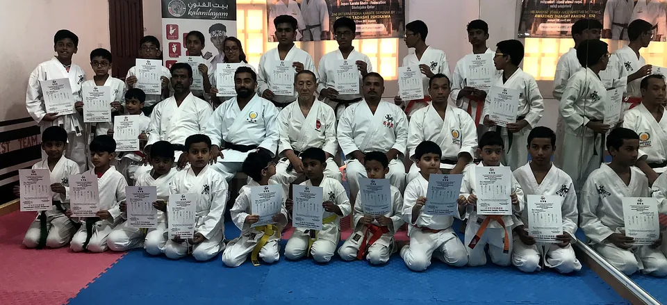 Chi Club students holding certificates after a karate seminar in Doha