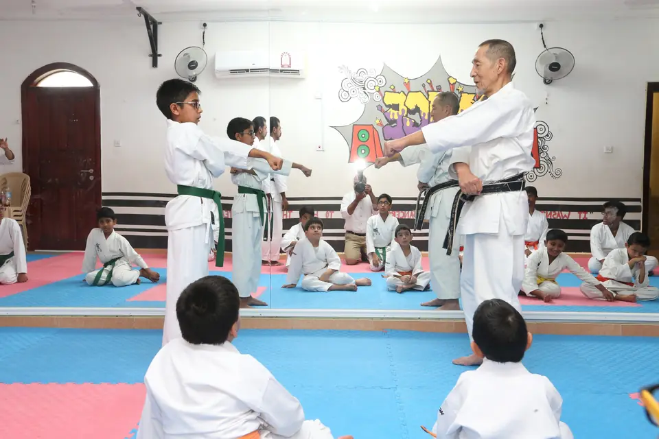 Sensei correcting a student’s stance